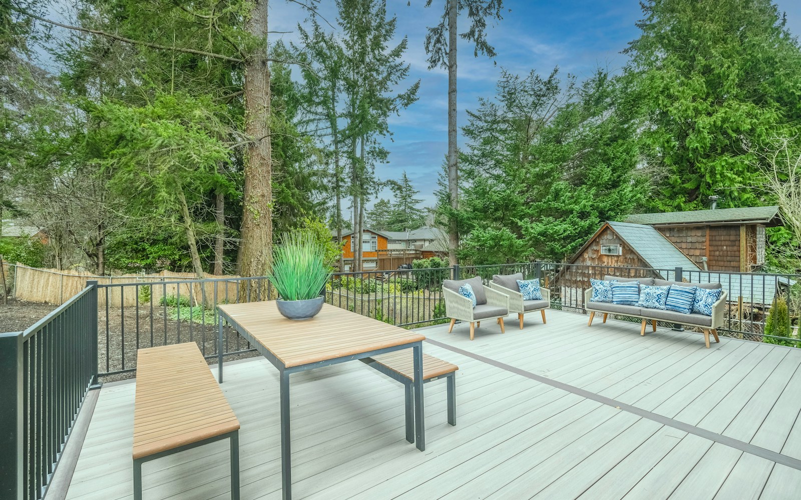 Composite deck patio with low-maintenance finish and railing