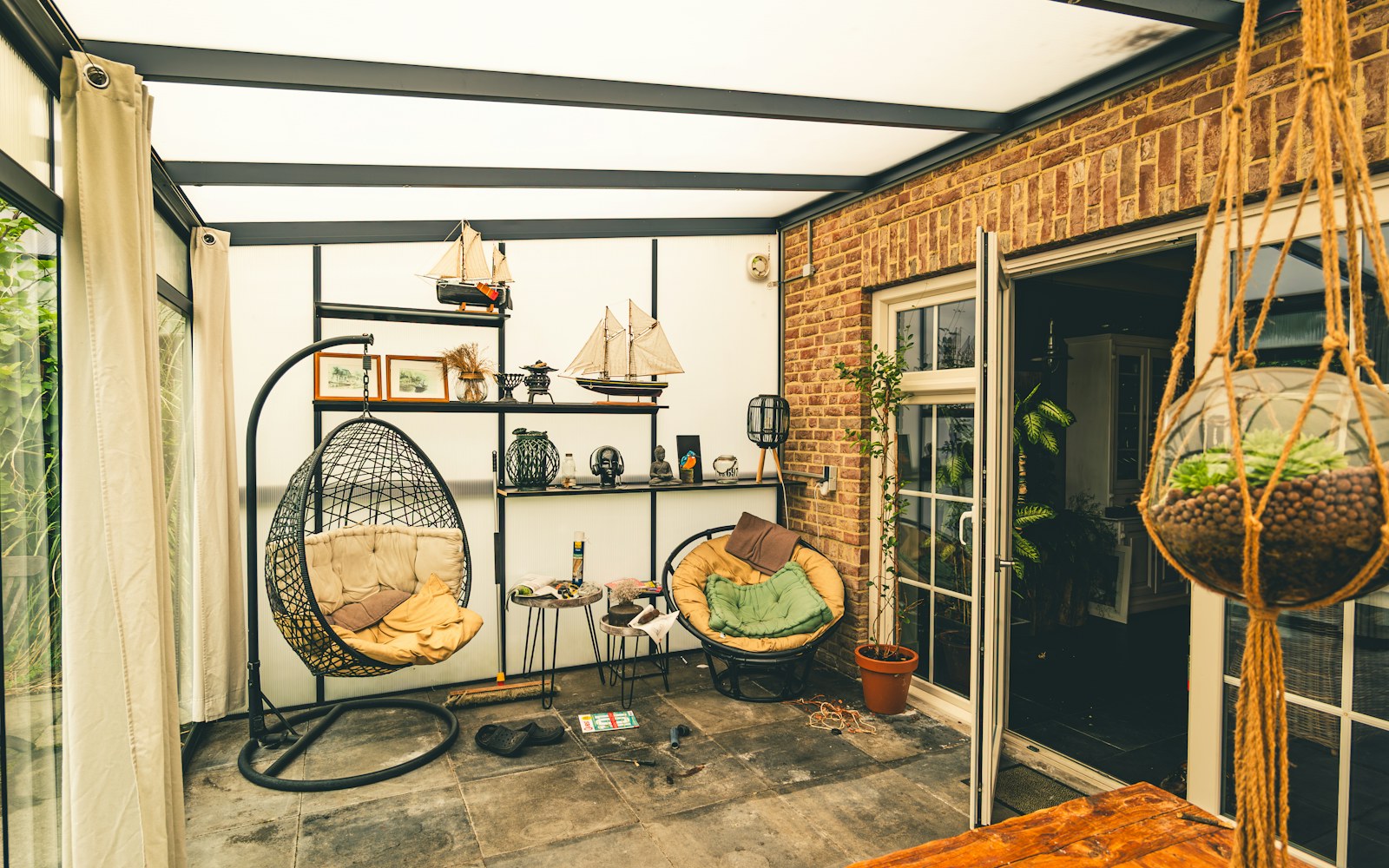 Cozy sunroom interior with seating and natural light